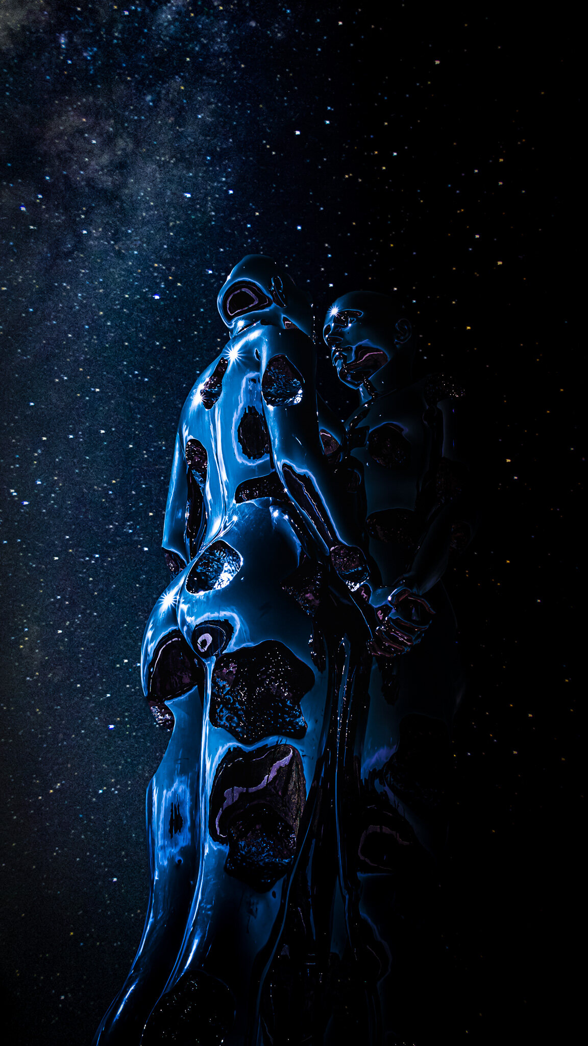 Two glossy sculpted figures lit in cobalt blue standing beneath a sky thick with stars